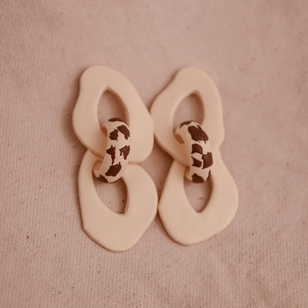 Aretes Iris Cow Print
